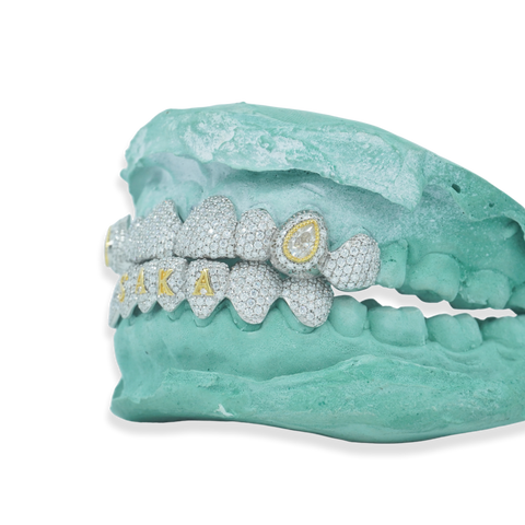 Custom Iced Out Grillz W/ Pear Cut Stones on Fang